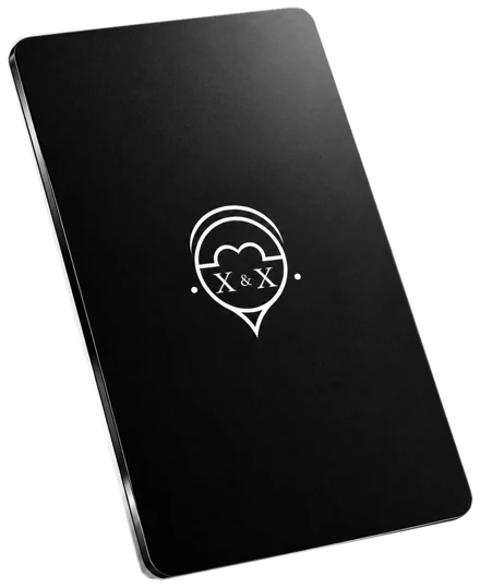 X&X Tap Card — matte black portrait NFC card with the small white X&X emblem